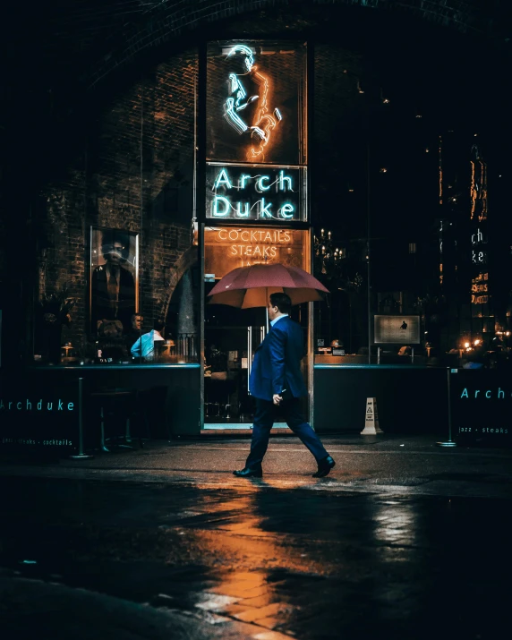 a man walking in the rain with an umbrella, an album cover, by Andrew Domachowski, unsplash contest winner, city midnight neon lights, big arches in the back, standing in a restaurant, handsome man