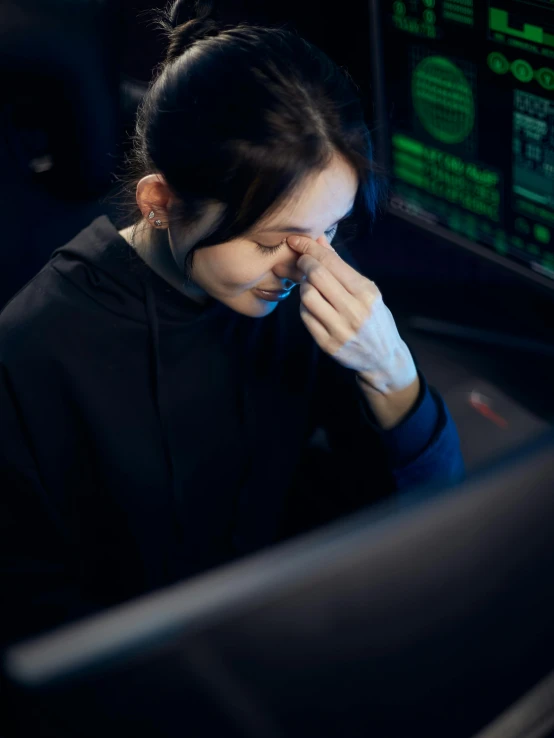 a woman sitting in front of a computer screen, by Adam Marczyński, hurufiyya, looking exhausted, cryptidcore, profile image, instagram post