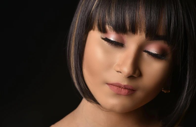 a close up of a woman holding a cell phone, an album cover, inspired by Natasha Tan, hurufiyya, makeup. unreal engine, with a black background, asian human, taken with sony alpha 9