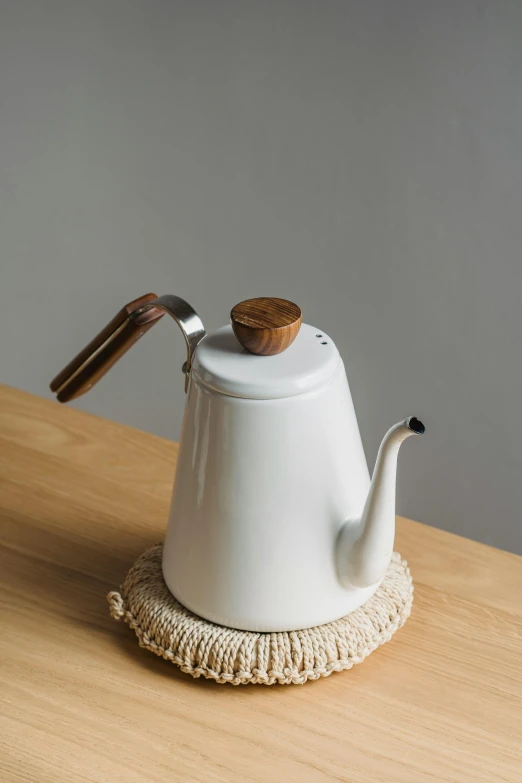 a white tea pot sitting on top of a wooden table, product image, cone, long arm, thumbnail