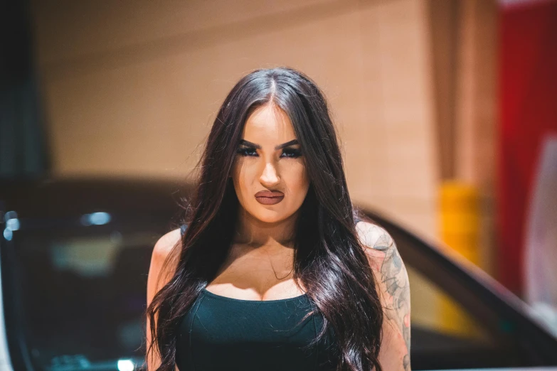 a beautiful young woman standing in front of a car, a tattoo, inspired by Elsa Bleda, trending on pexels, thick dark hair, duckface, 15081959 21121991 01012000 4k, tanned ameera al taweel