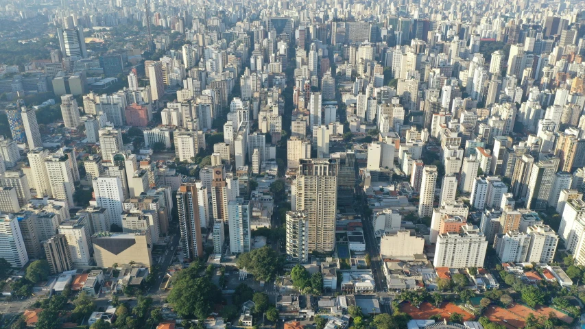 an aerial view of a city with tall buildings, by Fernando Gerassi, photo taken in 2018, hosada, lots of building, flat