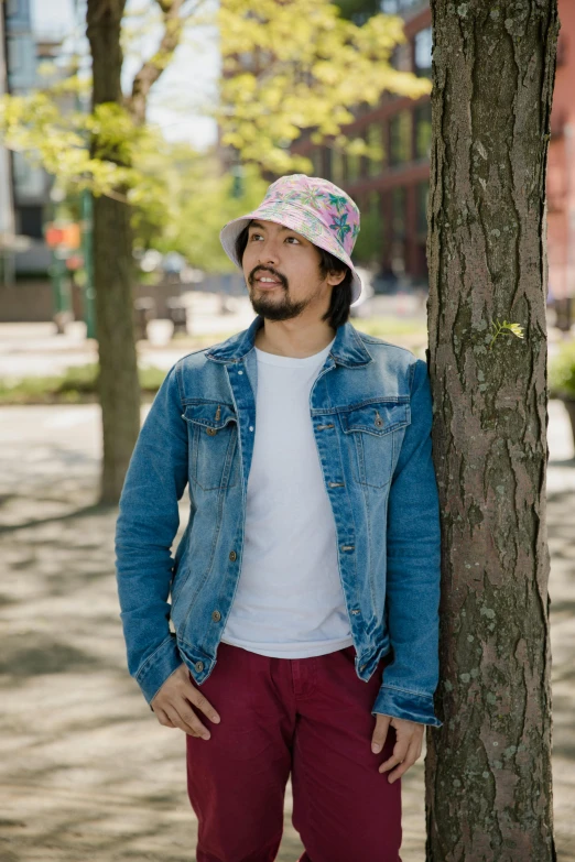 a man standing next to a tree wearing a hat, jean jacket, james jean style, wearing wide sunhat, pokimane