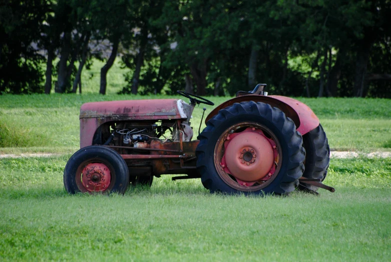 a red tractor sitting on top of a lush green field, by David Simpson, pixabay, auto-destructive art, looking old, slightly tanned, avatar image, wrinkles and muscles