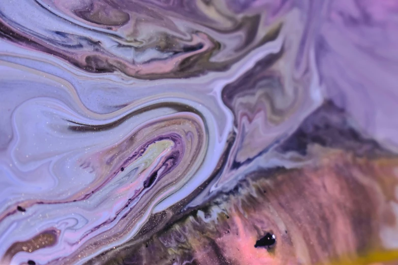 a close up of a piece of art on a table, by Sophie Pemberton, trending on pexels, process art, purple liquid, lsd waves, earth and pastel colors, silver dechroic details