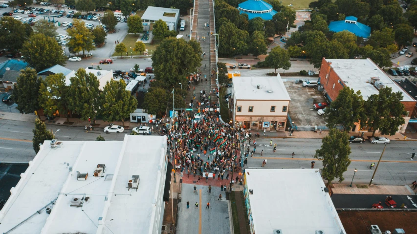 a crowd of people standing on top of a street, by Meredith Dillman, unsplash contest winner, renaissance, bentonville arkansas, aerial footage, square, protest