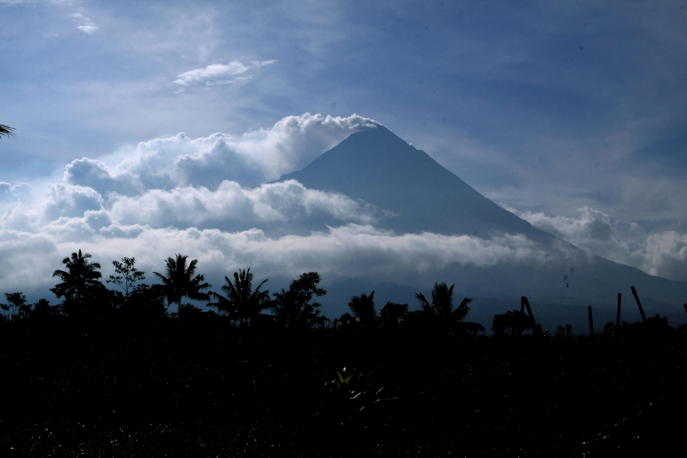 a view of a mountain with clouds in the sky, sumatraism, avatar image, photographed for reuters, bali, thumbnail