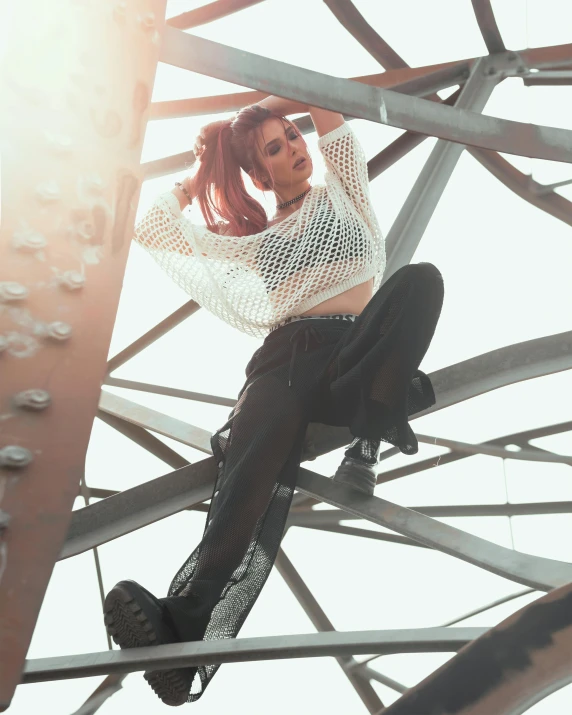 a woman sitting on top of a metal structure, trending on pexels, arabesque, wearing punk clothing, translucent, bella poarch, bouncing