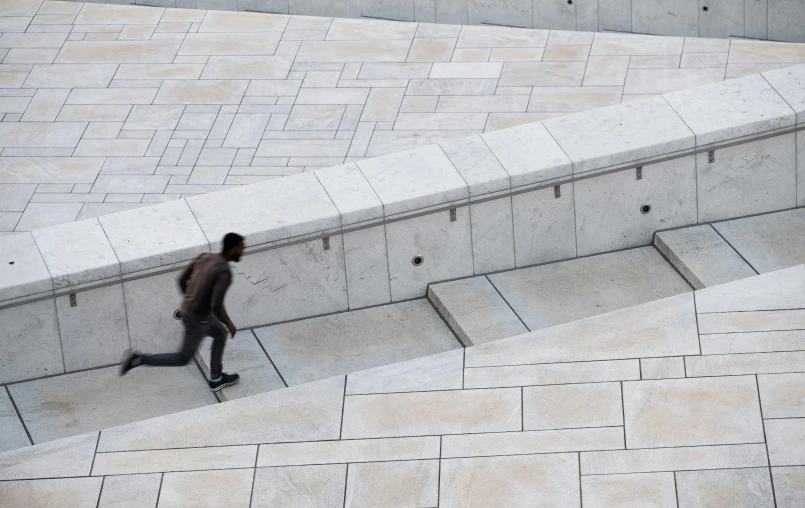 a man riding a skateboard down a flight of stairs, a marble sculpture, inspired by David Chipperfield, unsplash contest winner, concrete art, tessellation, ignant, people outside walk, pearly flagstones