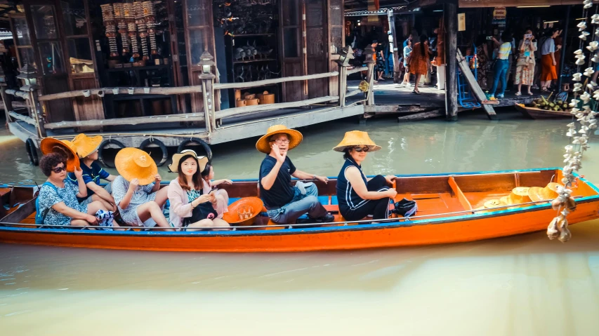 a group of people riding on top of a boat, pexels contest winner, mingei, gondola, avatar image, canals, in style of pan ren wei