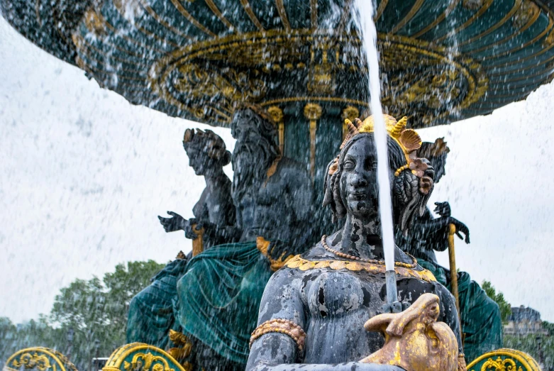 a statue of a woman sitting on top of a fountain, a statue, by Daniel Gelon, pexels contest winner, art nouveau, ornate with gold trimmings, square, shot on sony a 7 iii, louis xiv