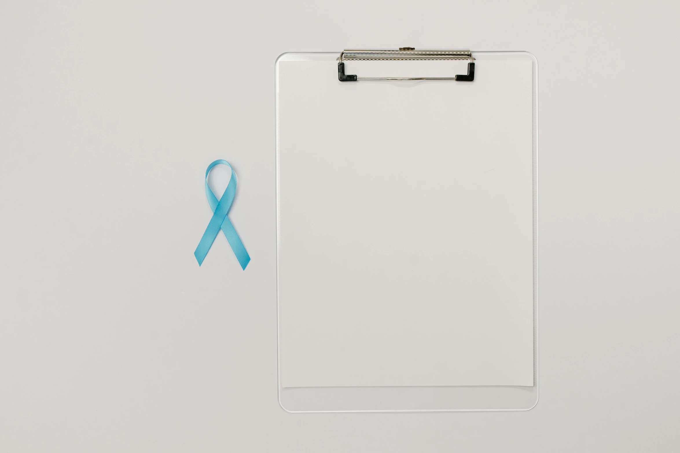 a clipboard with a blue ribbon on it, a photo, by Matija Jama, visual art, the cure for cancer, whiteboards, light cyan, 15081959 21121991 01012000 4k