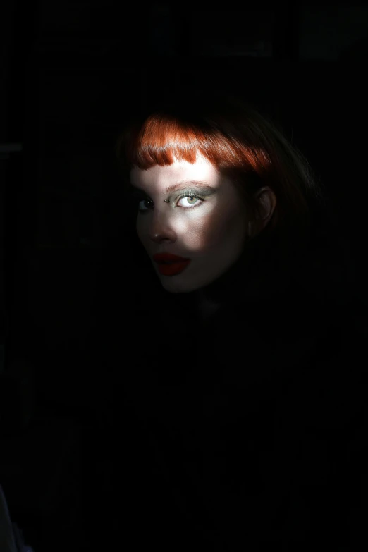 a woman with red hair in a dark room, an album cover, pexels, bauhaus, michael hussar, medium format. soft light, red - eyed, 15081959 21121991 01012000 4k