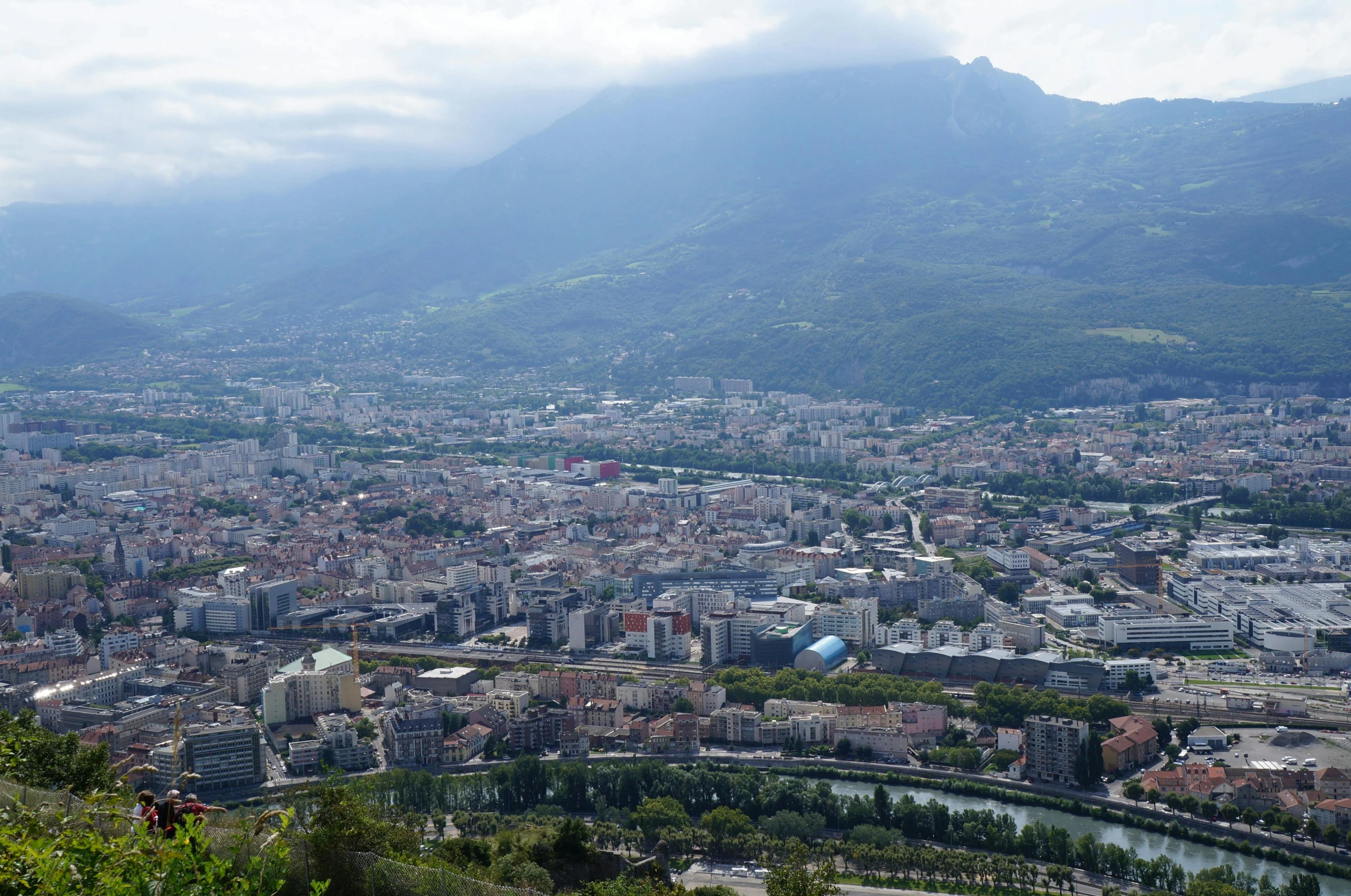 a view of a city with mountains in the background, a picture, les nabis, gigapixel photo, guide, high detail photo, a blond