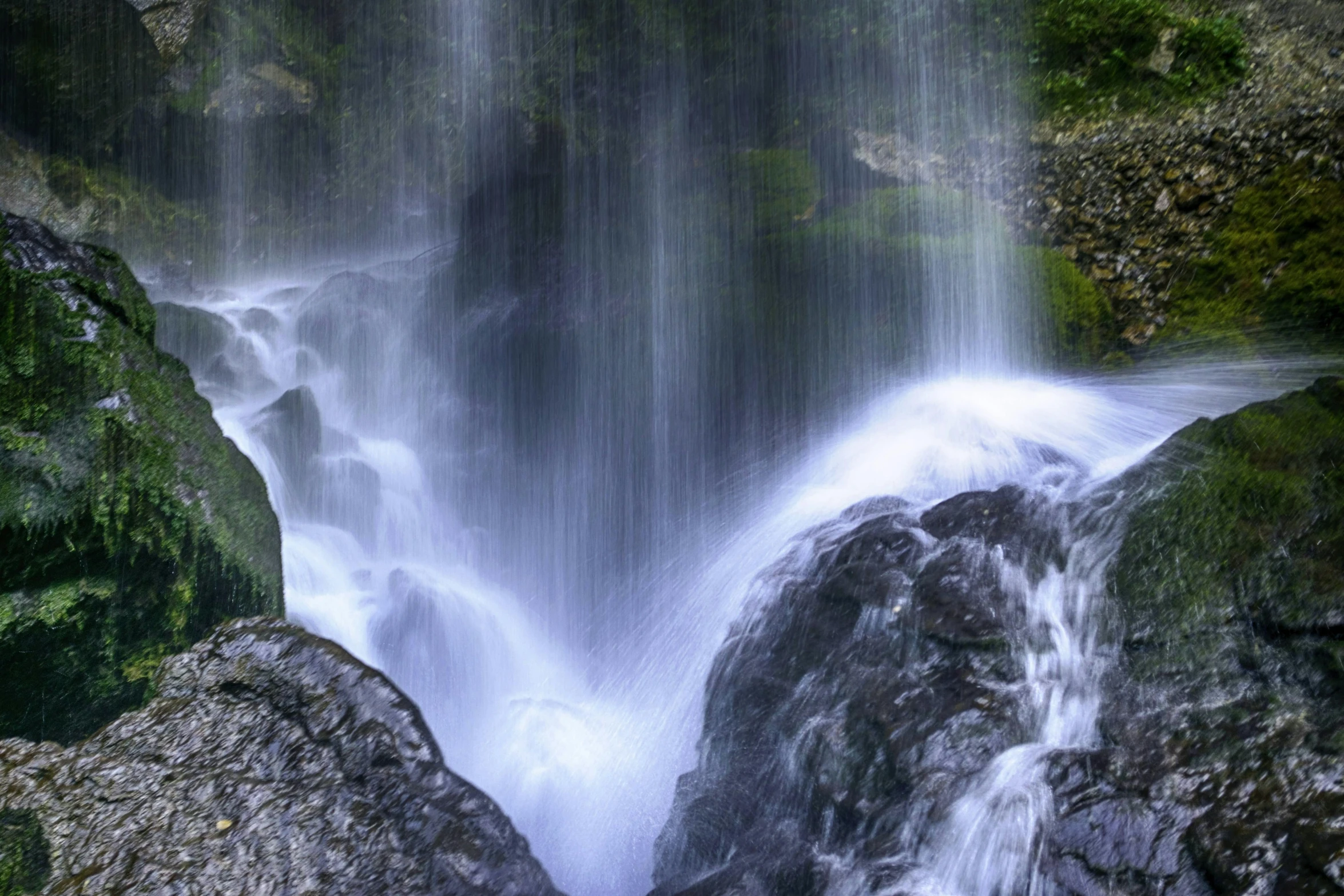 a waterfall in the middle of a lush green forest, pexels contest winner, romanticism, panoramic shot, fan favorite, slow exposure hdr 8 k, wet rocks