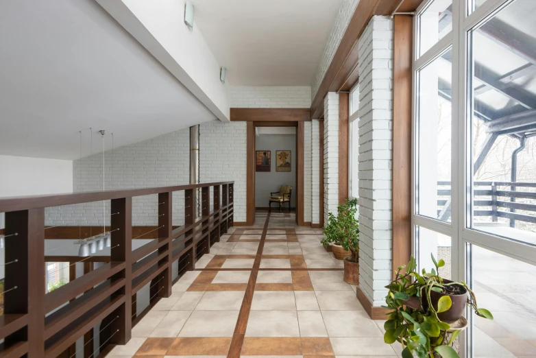 a long hallway with tiled floors and wooden railings, by Alexander Fedosav, modernism, neo kyiv, 15081959 21121991 01012000 4k, patio, natural lighting. 8 k