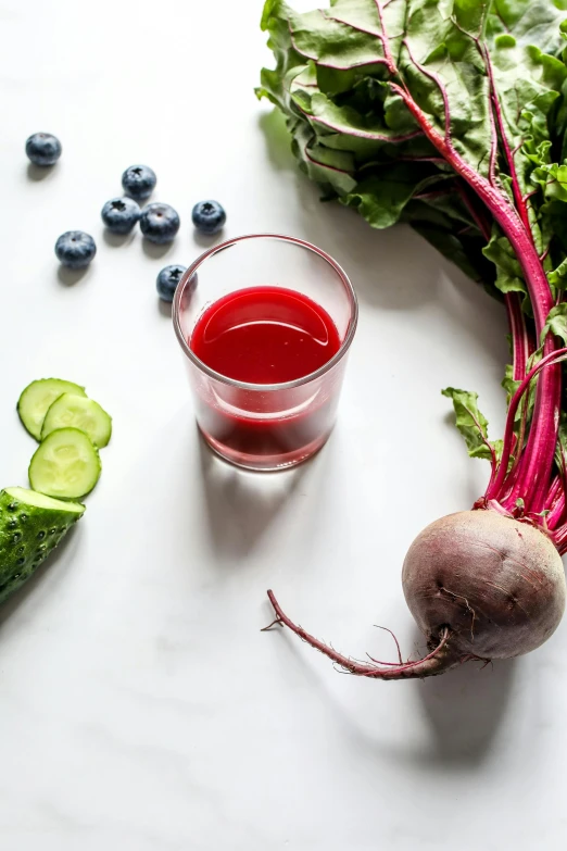 beets, cucumbers, and blueberries on a table, unlimited juice, zoomed in, product shot, red velvet