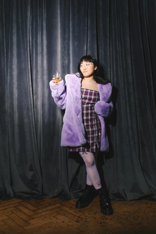 a woman standing in front of a black curtain, purple checkerboard, coat for a rave with fur, nanae kawahara, ((purple))