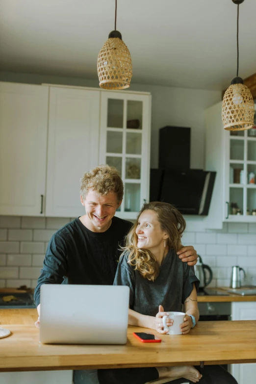 a man and a woman sitting at a kitchen table with a laptop, a picture, pexels contest winner, happening, happy couple, fairytale, a still of a happy, carson ellis