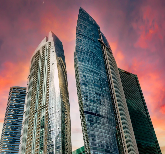 a couple of tall buildings sitting next to each other, godrays at sunset, architectural photo, featured, manila