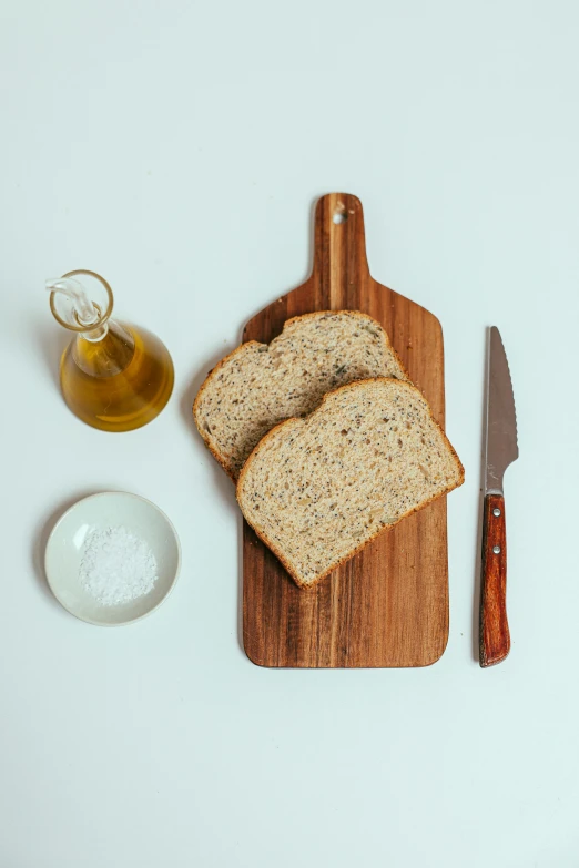 a wooden cutting board topped with slices of bread, a still life, unsplash, “ full body, olive oil, 1 6 x 1 6, single