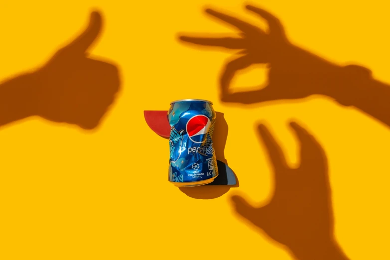 a can of pepsi sitting on top of a table, a picture, inspired by Tom Wesselmann, trending on pexels, hands in air, shadow play, sprites, dramatic product shot