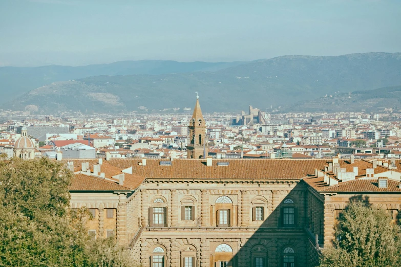 a view of a city from the top of a hill, by Lubin Baugin, pexels contest winner, renaissance, wes anderson background, bargello, slightly sunny, 🚿🗝📝