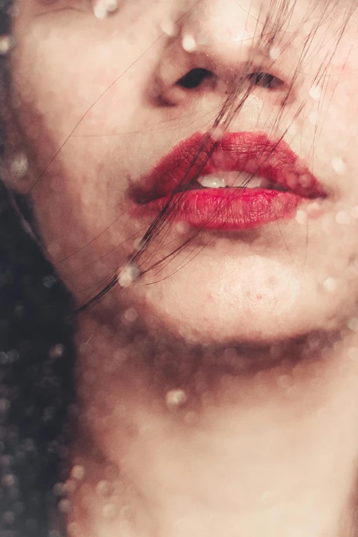 a close up of a woman's face in the rain, an album cover, inspired by Elsa Bleda, trending on pexels, renaissance, vibrent red lipstick, snow on the body, grainy. poorly rated, dreaming of kissing a girl