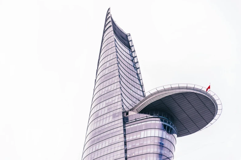 a tall building with a clock on top of it, inspired by Zha Shibiao, unsplash contest winner, shaped like a yacht, warsaw, curved lines, pastel'