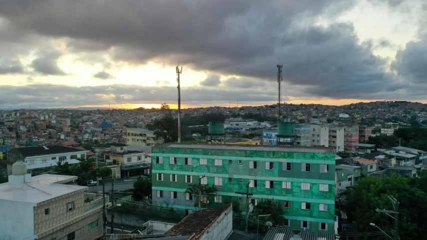 a view of a city from the top of a building, madagascar, profile image, fan favorite, sun setting