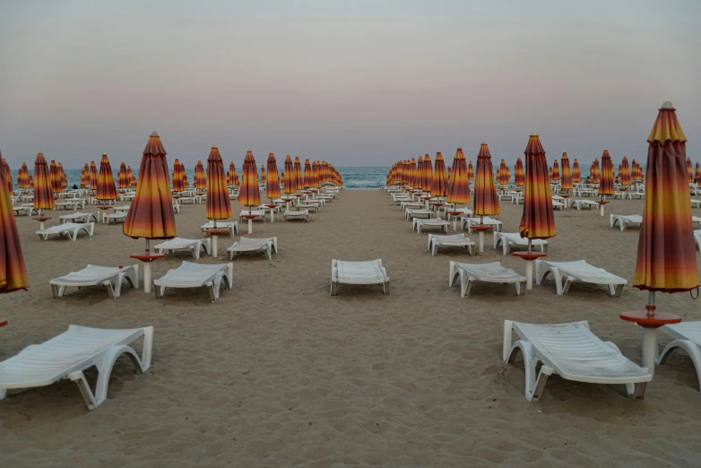 a number of lounge chairs and umbrellas on a beach, a portrait, by Carlo Martini, unsplash contest winner, renaissance, square, calm evening, panorama, 15081959 21121991 01012000 4k