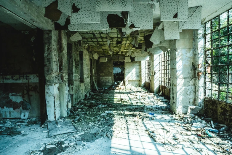 the sun shines through the windows of an abandoned building, an album cover, unsplash contest winner, arte povera, nuclear aftermath, 2000s photo, post apocalyptic palace interior, promo image