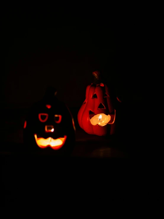 a couple of pumpkins sitting next to each other, a photo, pexels, vanitas, lights off, low quality photo, profile image, scaring