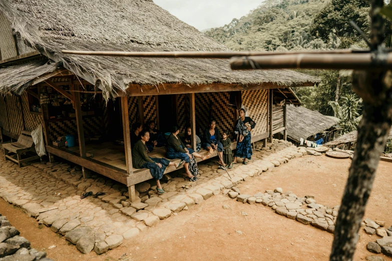 a group of people sitting outside of a hut, by Emma Andijewska, pexels contest winner, hurufiyya, vietnam, instagram post, teaser, thumbnail