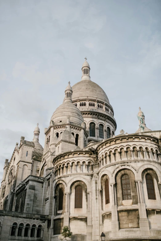 a large building with a dome on top of it, trending on unsplash, paris school, church cathedral, low quality photo, multiple stories