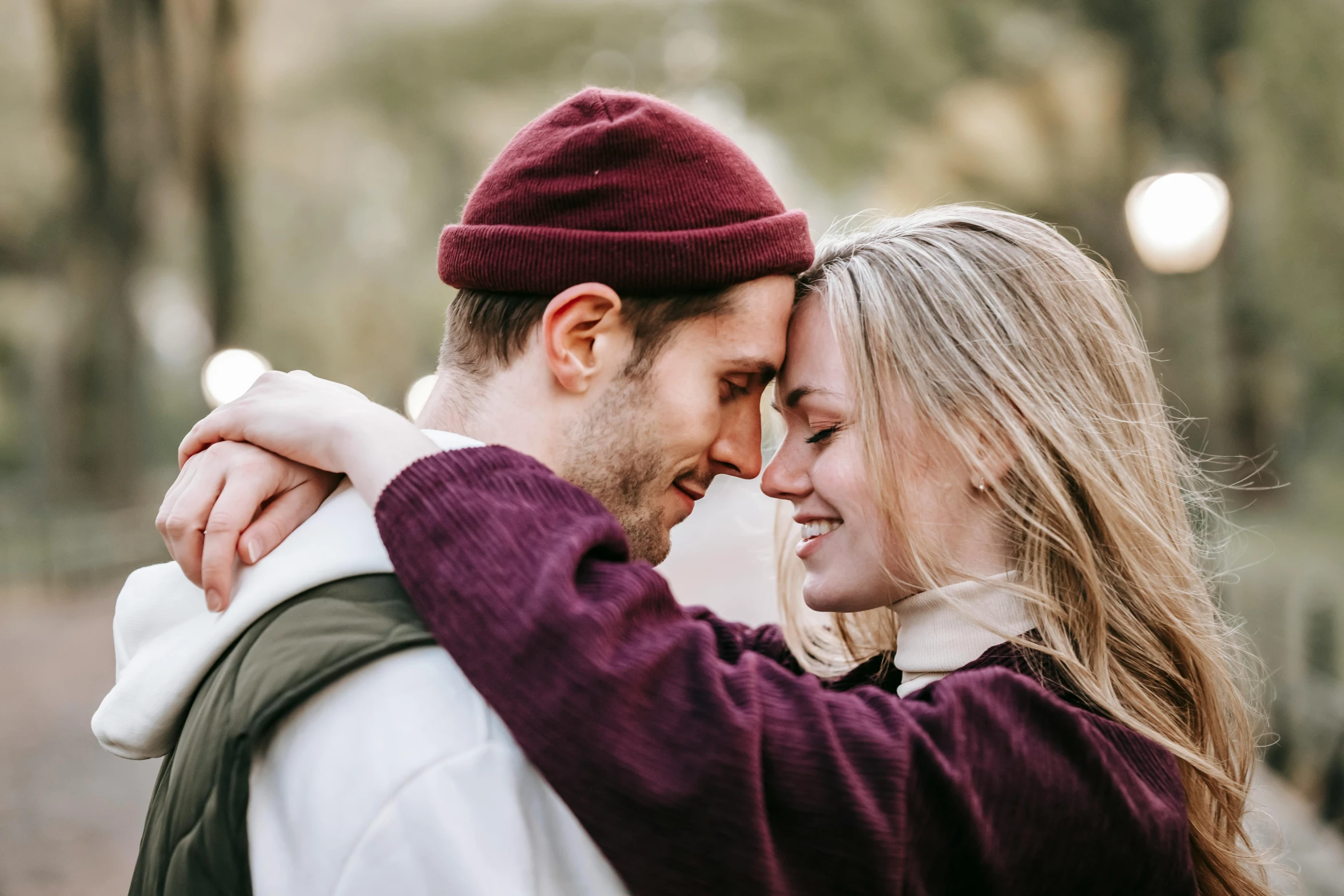 a man and a woman standing next to each other, a photo, trending on pexels, sweet hugs, mid-20s, medium close up, exciting