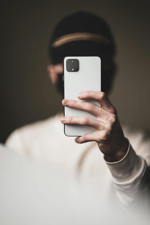 a man taking a selfie with his cell phone, by Adam Rex, trending on pexels, hypermodernism, no face mask, matte white paint, a portrait of an android, modern minimalist f 2 0 clean