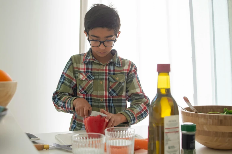 a young boy cutting tomatoes on a cutting board, inspired by Yukimasa Ida, mixing drinks, full body hero, mohamed chahin, uncropped