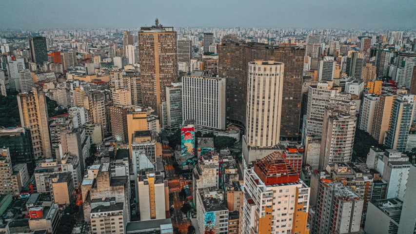 a view of a city from the top of a building, by Ceferí Olivé, high rise buildings, caio santos, unsplash 4k, 2 0 0 0's photo