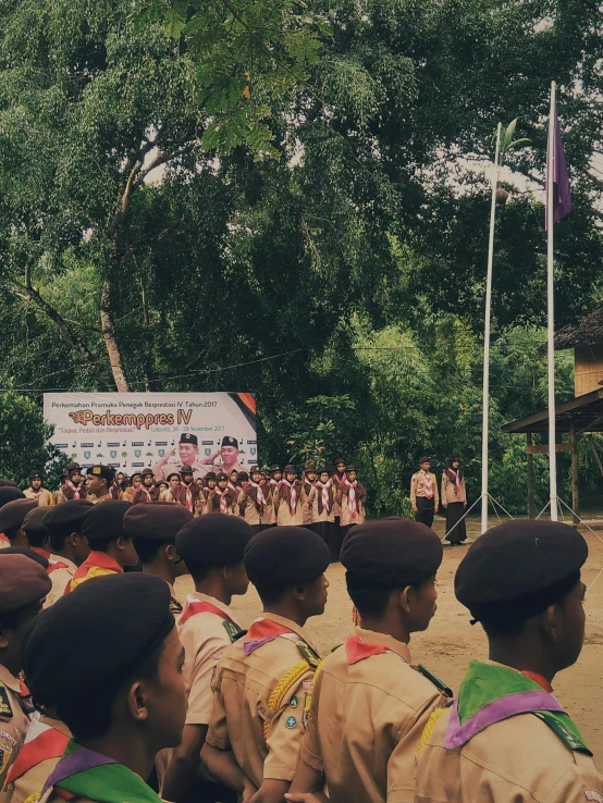 a group of young men standing next to each other, unsplash, sumatraism, boy scout troop, background image, giving a speech, ( land )