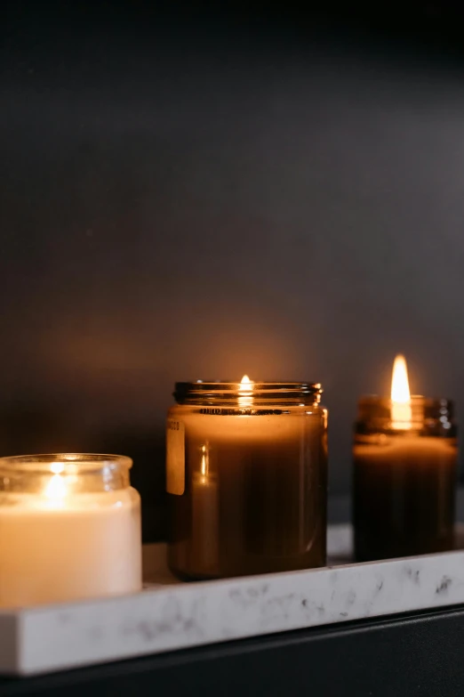 a row of candles sitting on top of a shelf, profile image, dwell, backlighted, multiple details