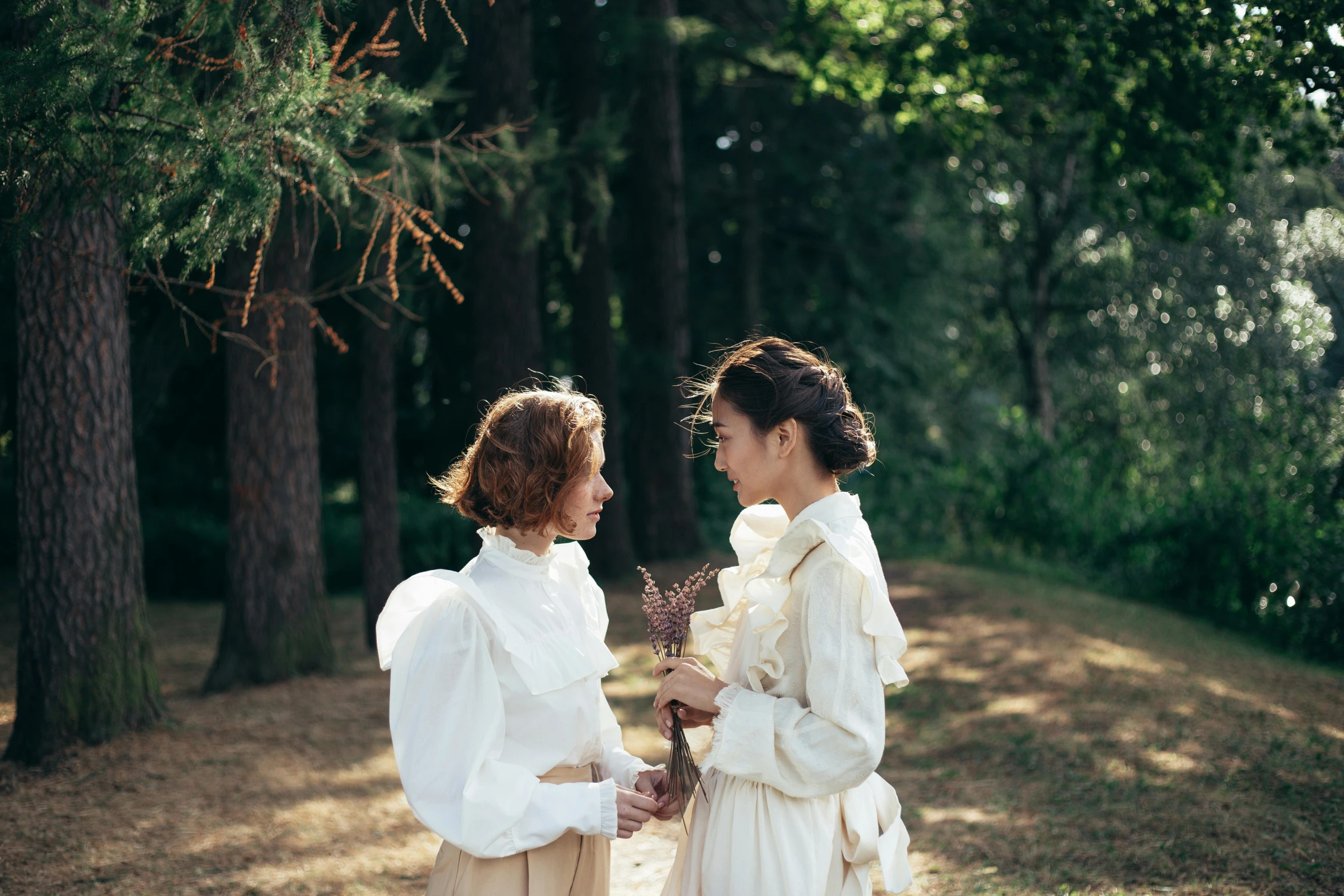 a couple of women standing next to each other, unsplash, romanticism, cottagecore, portrait image, live-action adaptation, white clothing