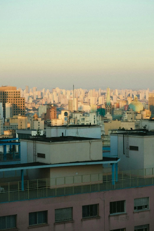 a view of a city from a high rise building, caio santos, alvaro siza, early evening, sparsely populated