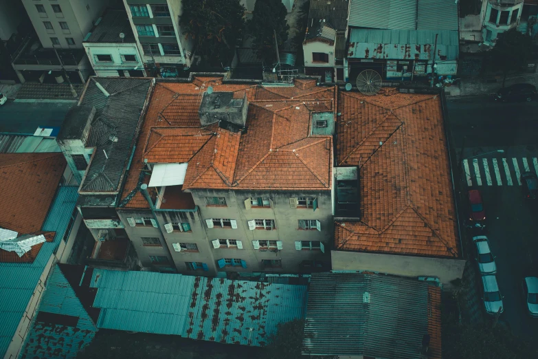 an aerial view of a building with a red roof, a colorized photo, by Emma Andijewska, pexels contest winner, hyperrealism, old apartment, roof background, lo-fi, istanbul