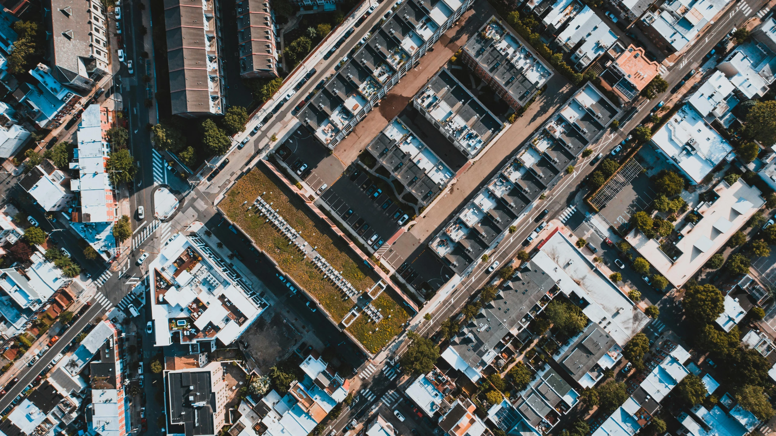 an aerial view of a city with lots of buildings, by Carey Morris, unsplash contest winner, square, ground angle uhd 8 k, flattened, thumbnail