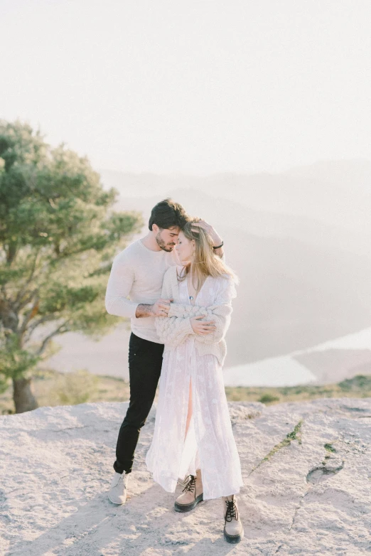 a man and woman standing on top of a mountain, by Sara Saftleven, trending on unsplash, romanticism, in spain, romantic dress, white background, 15081959 21121991 01012000 4k