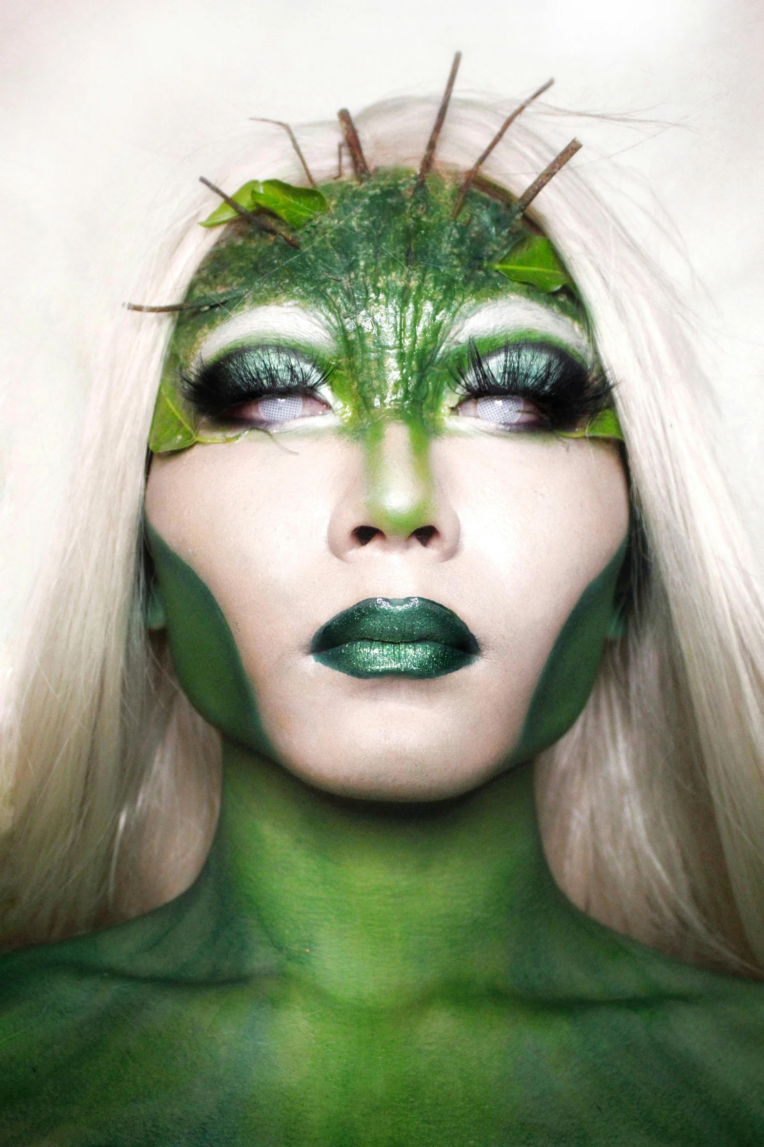 a close up of a woman with green makeup, an album cover, inspired by Art Green, ecological art, dryad, gemma chen, cl, chris cunningham