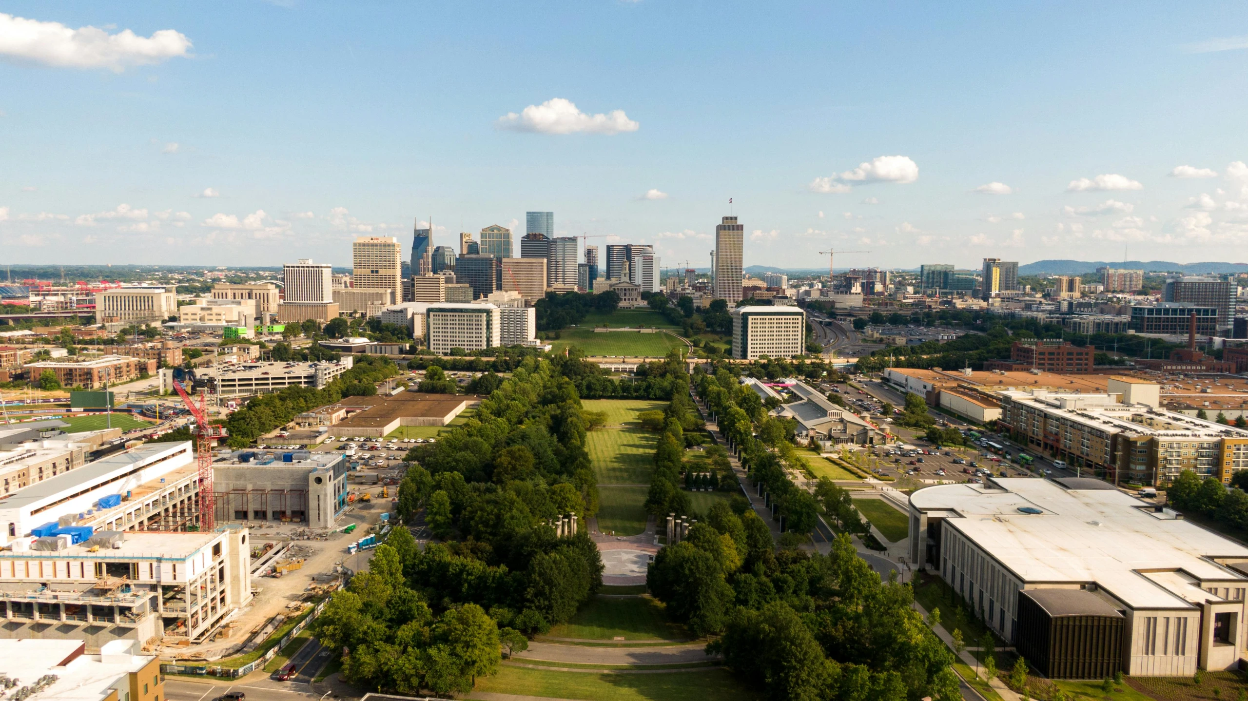 a view of a city from a bird's eye view, by Dan Frazier, unsplash contest winner, realism, grassy knoll, capital plaza, 2022 photograph, the imperial palace