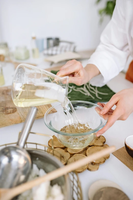 a person pouring something into a bowl on a table, gourmet and crafts, chemistry, square, thumbnail