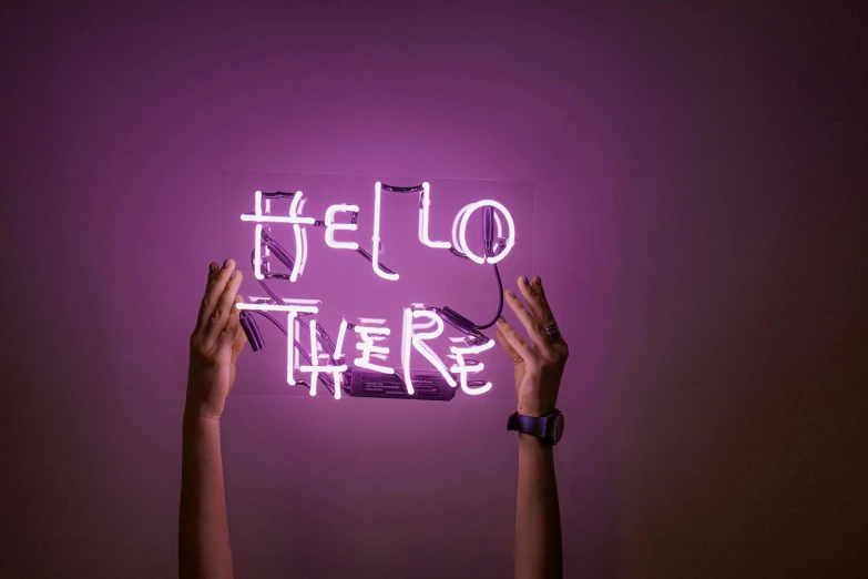a person holding a neon sign that says hello there, by Helen Stevenson, trending on unsplash, interactive art, ((purple)), neon inc, lightweight, ilustration